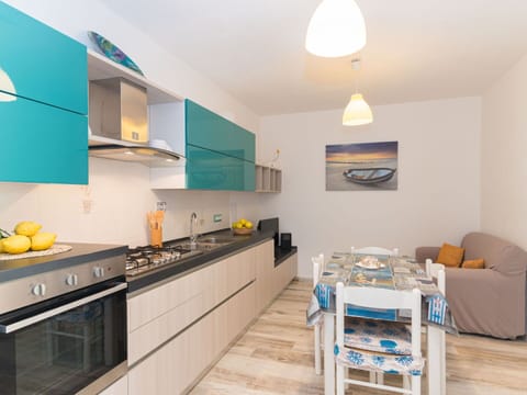 Countertop, Property, Cabinetry, Furniture, Azure, Wood, Interior Design, Lighting, Kitchen Stove, Wall