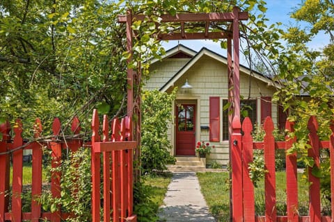 Step into the storybook charm of this North End corner cottage, where tree-lined streets and blooming gardens set the scene for your Boise escape