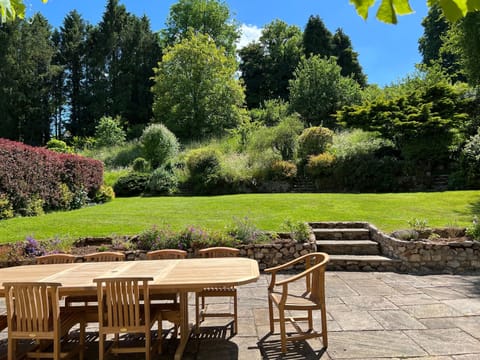 Solid teak table with 8 chairs. Our professional gardeners are making magic 