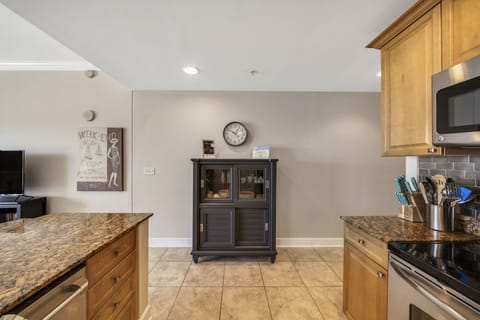 The fully equipped kitchen features granite countertops, stainless-steel appliances, and has everything you need to prepare meals for family and friends.