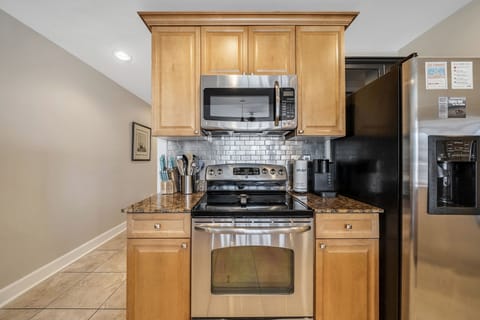 The fully equipped kitchen features granite countertops, stainless-steel appliances, and has everything you need to prepare meals for family and friends.