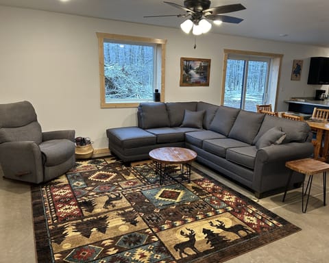 Downstair’s Living room with great views of the North Woods. 