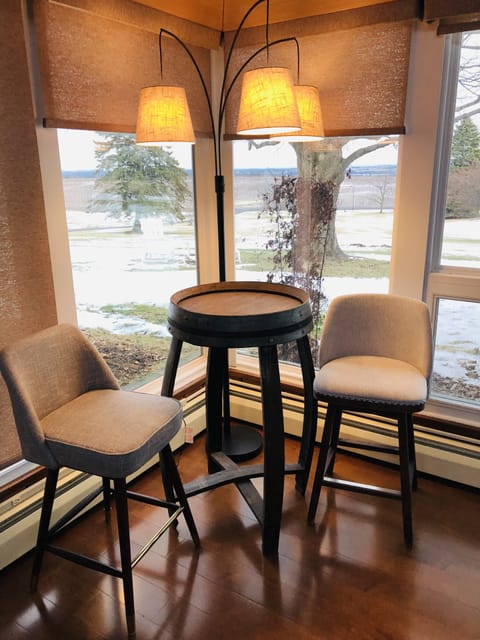 Chat with friends at our bistro seating in the living room