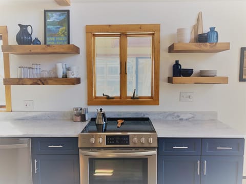 Stove features 4 burners and a warming burner as well.