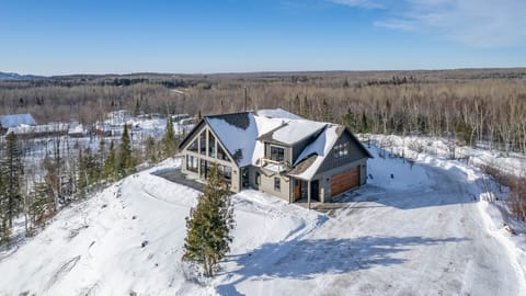 Aerial View of house on top of the bluff. 