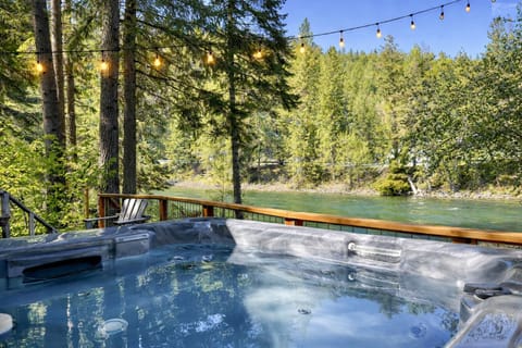 Relax in a private hot tub overlooking the tranquil Wenatchee river.