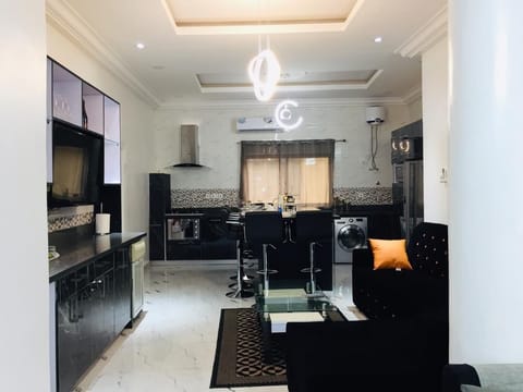 Second living area, bar area, dining and kitchen area