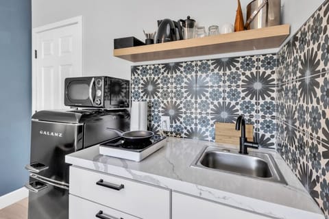 Cook your own meals in your kitchenette with cooking basics and appliances: microwave, stove, refrigerator