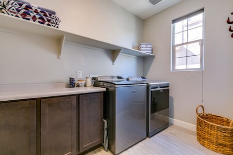 Laundry room with plenty of space, full size washer/dryer.