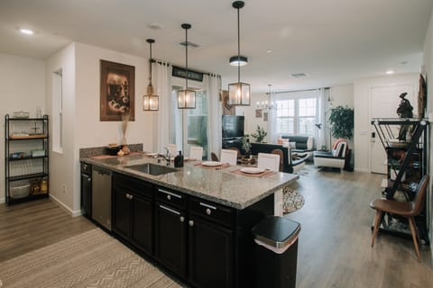 Large eat in island, spacious galley kitchen, dining nook, & covered patio 