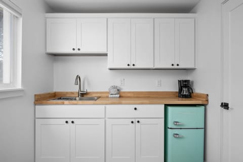 Enjoy a nice meal in the kitchenette area equipped with a mini-fridge, coffee maker, and microwave.