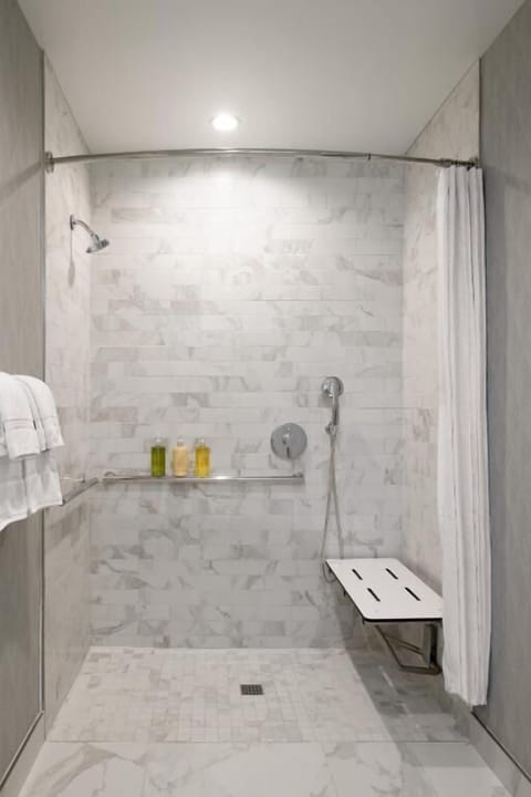 Rinse off easily with a wide, accessible shower and bench.