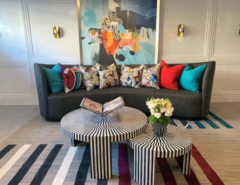 Enter a bright, art-filled lobby that feels instantly elevated.