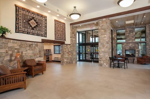 Unwind in the airy lobby surrounded by cozy lodge details.