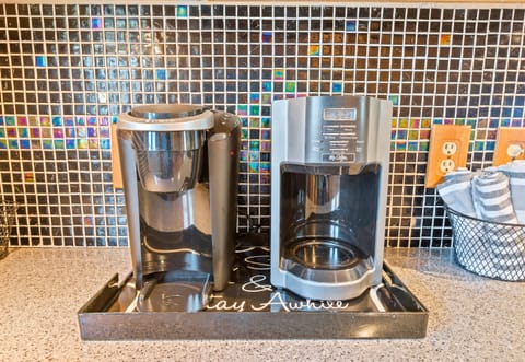 Coffee lovers will appreciate this well-stocked coffee station, ready to kickstart your mornings with a perfect cup of joe.