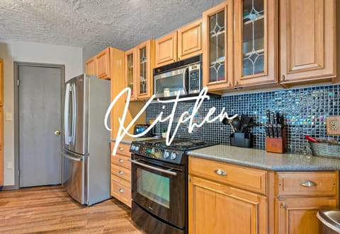 Whip up delicious meals in this modern kitchen, complete with sleek stainless steel appliances and plenty of counter space for all your culinary creations.