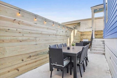 Outdoor area with grill and seating