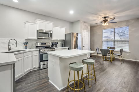 Sleek finishes and top-tier appliances define this stylish kitchen.