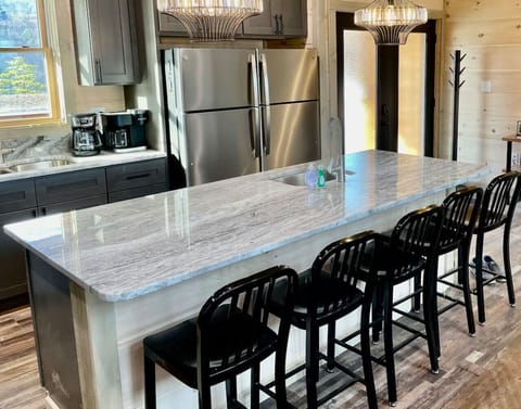 The kitchen has granite countertops as well as both a regular coffee maker and a Keurig Duo.