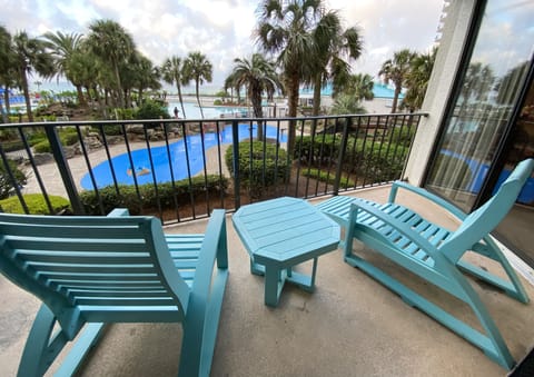Tower 1 condo 110 balcony overlooks the main lagoon pool and splash pad.