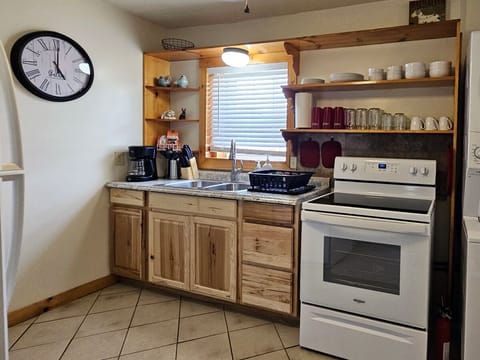 Full kitchen stocked with all the basics for you to enjoy cooking your own meals