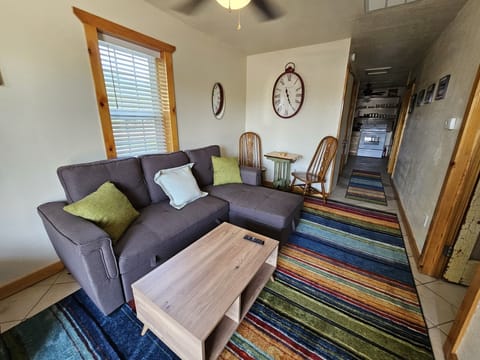 Cozy living room with couch that opens to a double bed