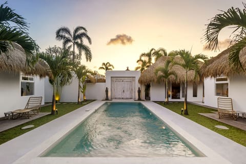 View of the villa’s entrance and outside pool 
