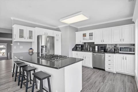 Peninsula counter with stool seating for four.