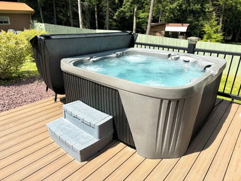 6 person Hottub with jets on the back deck overlooking the private backyard