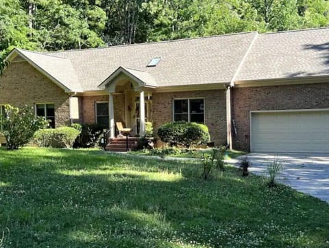 Front view, early spring before gardens bloomed. Yard maintenance included.