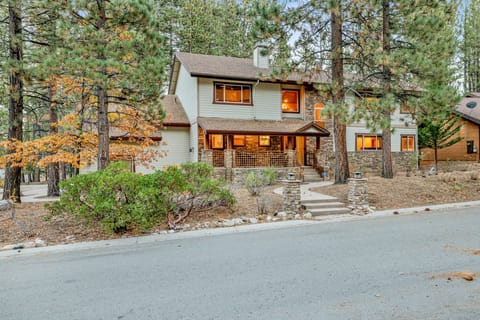 Welcoming cabin entry surrounded by towering pine trees, offering fresh mountain air and a peaceful forest setting—the perfect first impression for your Big Bear Lake getaway.