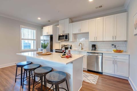 Fully equipped kitchen boasting stainless-steel appliances and stocked with all culinary essential for your convenience.