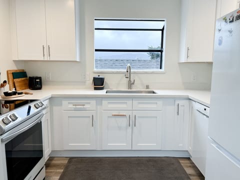 Farm sink. Garden window with views of the hills.