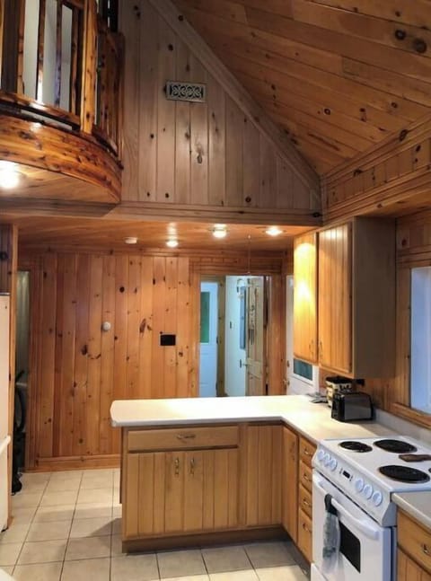 Kitchen with electric range, coffee maker, air fryer and blender