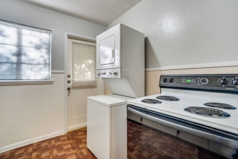 Washer/dryer by the backdoor to the yard