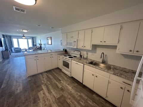 New granite countertops and flooring in the kitchen May 2023.