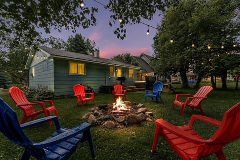 Enjoy a cozy backyard with a firepit, string lights and hot tub!