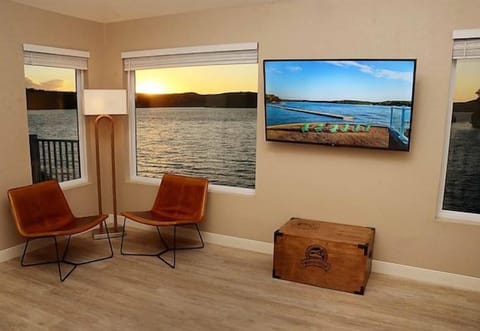 Lounge by wide windows and watch the lake drift by.