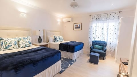 Relax in a serene king room with warm, cozy lighting.