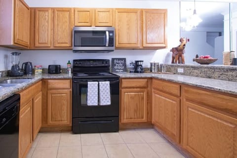 Fully equipped kitchen with modern appliances—perfect for cooking meals and feeling at home.