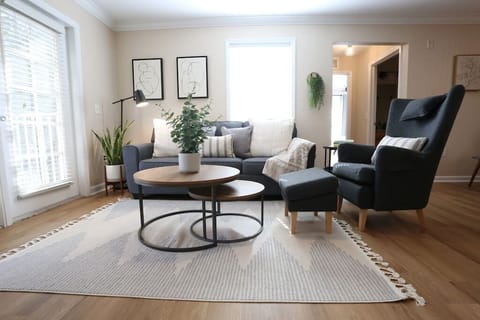 Your Peaceful Home Away From Home. Relax in a bright, airy living room styled with modern comforts and organic touches. Whether you’re streaming your favorite show or planning your day’s adventure, this cozy nook is the ultimate retreat.