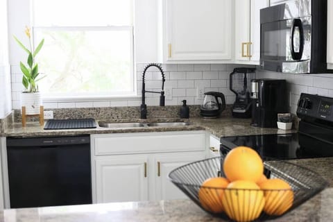 Fully equipped kitchen with modern appliances and thoughtful touches to make cooking easy and enjoyable.