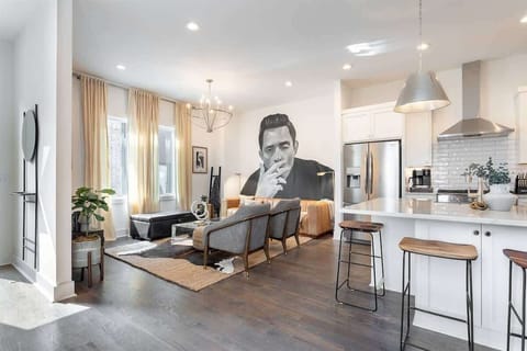 Spread out in the living room with ample seats and kitchen access.