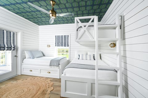 Kids room has plenty of space and a balcony to look out to the water.