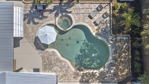 Our pool offers a sun shelf, built-in bench, and small round plunge area.