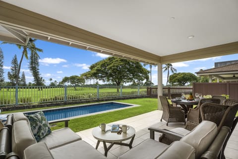 Covered lanai overlooking the private pool and Kona Country Club golf course greens.