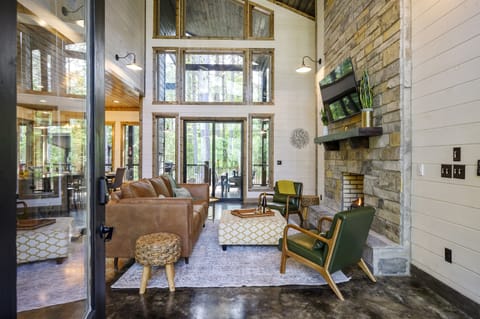 "Relaxation radiates from floor-to-ceiling windows in our sun-soaked living room."