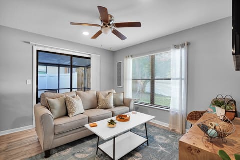 Modern, open-concept living space with a minimalist decoration style