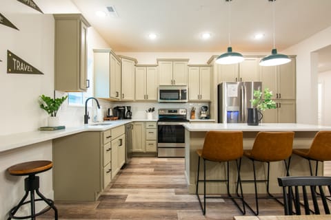 Kitchen with island providing more seating