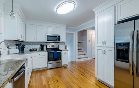 Fully equipped kitchen
with modern
appliances, cookware,
coffee maker, and
everything needed for
home cooked meals